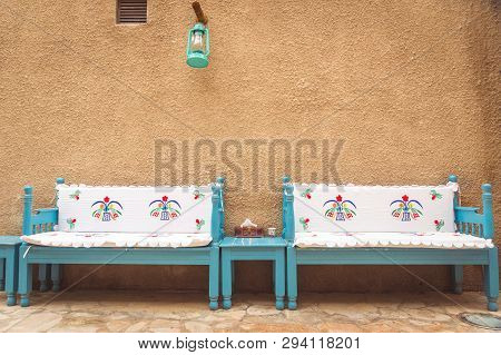 Traditional Arabic Bench In The Streets Of Old Dubai With An Old Lamp In Blue And White Colours And 