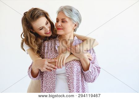 Happy Family Two Generations Old Mother And Adult Daughter On White Background