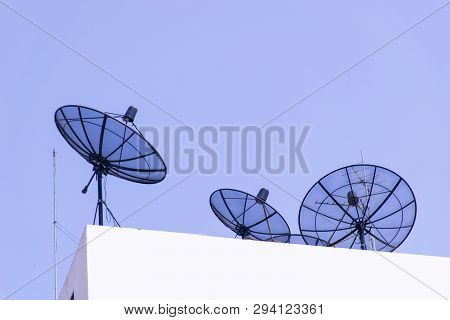 Boardcast Television Satelite On The Building With Blue Sky.