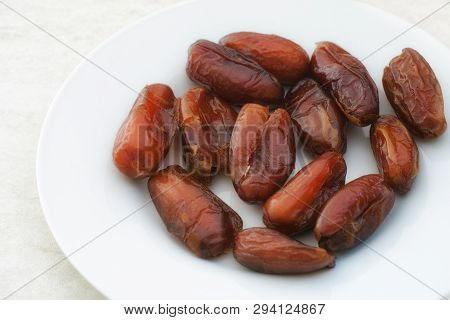 Organic Sun-dried Dates In A Plate. Close Up.