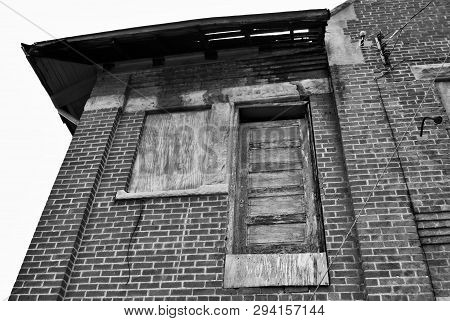 Abandoned Brick Train Depot With Tracks And Graffiti