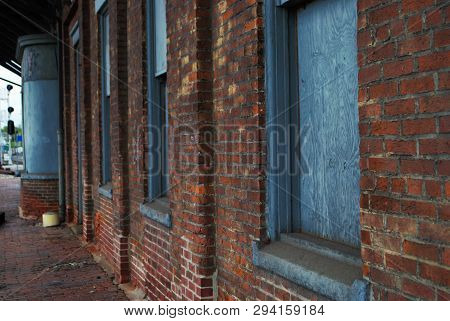 Abandoned Brick Train Depot With Tracks And Graffiti