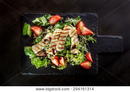 Salad With Grilled Halumi With Strawberries And Arugula.