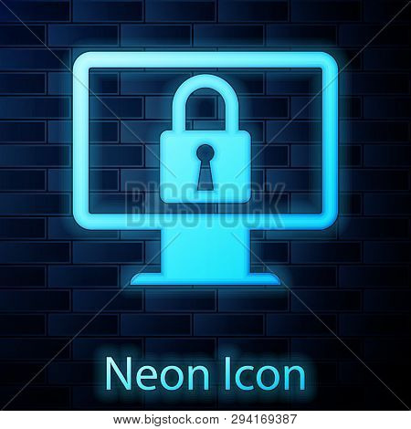 Glowing Neon Lock On Computer Monitor Screen Icon Isolated On Brick Wall Background. Monitor And Pad