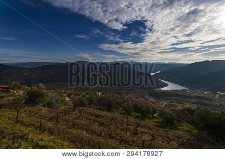 View Of The Pinhao Village With Terraced Vineyards And The Douro River, In Portugal; Concept For Tra