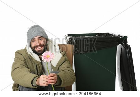 Poor Homeless Man With Flower Near Trash Bin Isolated On White