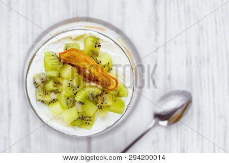 Trifle, Layered Mouse In Portioned Glass Jar. Seasonal Fresh Dessert Of Sponge Cake, Ripe Kiwi, Cust