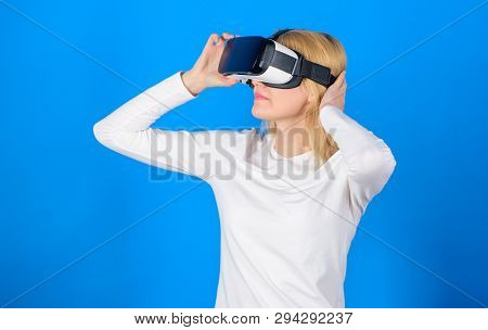 Happy Young Woman Wearing Virtual Reality Goggles Watching Movies Or Playing Video Games. Excited Sm