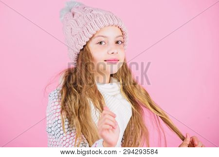 Girl Wear Knitted Hat Pink Background. Prevent Winter Hair Damage. Winter Hair Care Tips You Should 