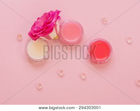 Lip Balms, Neutral And With Shades. Lip Skin Care, Hygiene And Cosmetics. Three Jars Of Balm On A Pi