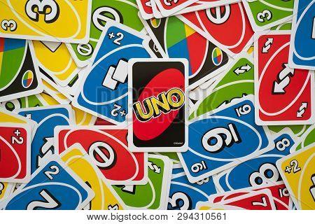 6 April 2019, Wuhan China : Uno Game Cards Scattered All Over The Frame And One Card Showing The Rev