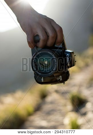 Cape Town, South Africa. 9 April 2019. A Hand Holding A Canon Eos 5 Aka Eos A2e Film Camera With A 2