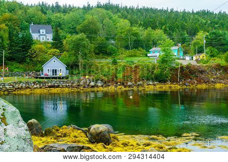 Views Of The Bay, Boats And Waterfront Buildings In The Fishing Village Aspotogan, Nova Scotia, Cana