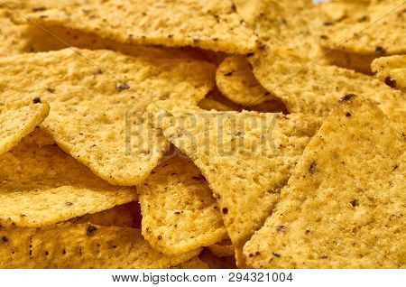 Background Yellow Triangular Corn Nachos With Seasonings