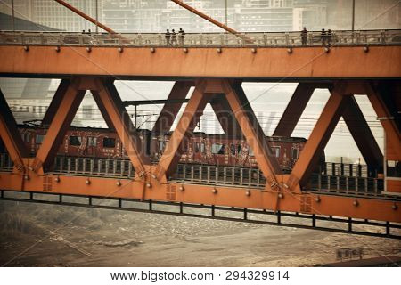CHONGQING, CHINA â MARCH 13: Train in Dongshuimen Bridge on March 13, 2018 in Chongqing. With 17M population, it is the most populous Chinese municipality.
