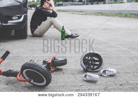 Image Of Shocked And Scared Driver After Accident Involved Kid's Bike And Helmet Lying On The Road O