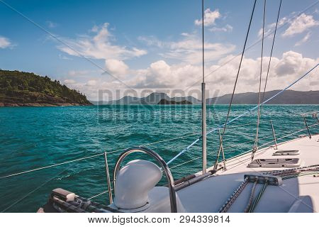 Sailboat Sailing On A Warm Beautiful Day In The Whitsunday Islands On The Great Barrier Reef In Aust