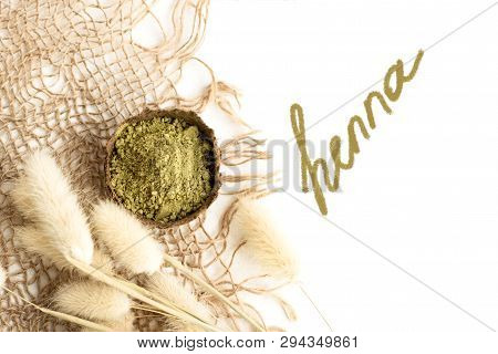 Henna Powder For Dyeing Hair And Eyebrows And Drawing Mehendi On Hands, Isolate With Green Palm Leaf