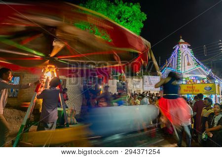 Howrah,west Bengal,india -april 15th, 2018 : Children Are Riding On Nagordola- A Traditional Amuseme