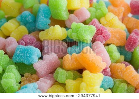 Many Multicolored Jelly Gummy Bears.yellow, Orange, Red, Pink, Blue And Green Jelly Bears On A Pile.
