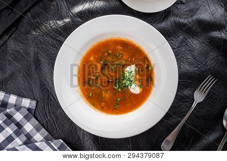 Red Beetroot Soup Borshch With Beef And Sour Cream On Black Table Top View