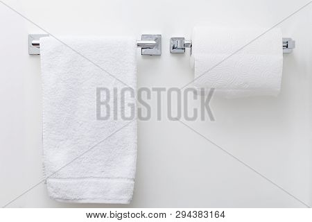 Modern Paper Towel Holder On White Wall Background With Copy Space