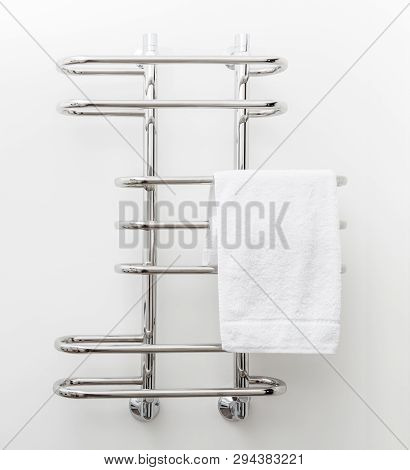 Modern Bathroom Towel Dryer On White Wall Background