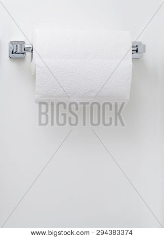 Modern Paper Towel Holder On White Wall Background With Copy Space