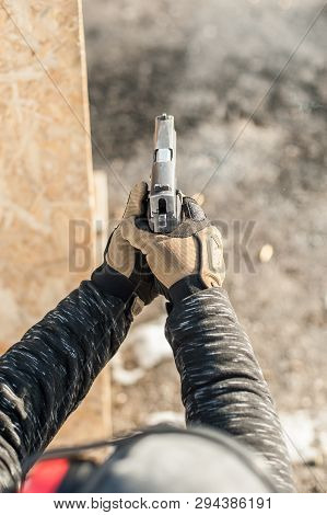Shooting On Target In Shooting Range. Back Close-up Detail View