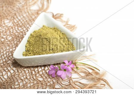 Henna Powder For Dyeing Hair And Eyebrows And Drawing Mehendi On Hands, Isolate With Green Palm Leaf