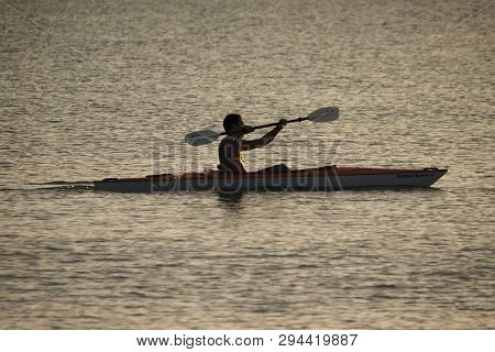 Captiva Island, Florida 08-05-2015 Young Man Kayaks Off The Beach In Captiva Island In Partial Silho