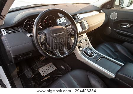 Novosibirsk, Russia - 03.10.2019: View To The Interior Of Land Rover Evoque With Dashboard, Clock, M