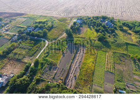 Top View Of The Village. One Can See The Roofs Of The Houses And Gardens. Road And Water In The Vill