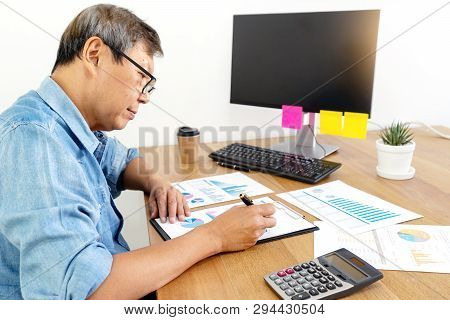 Senior Businessman Work With Friend On The Table With Computer Laptop Calulator ,working Data Analys
