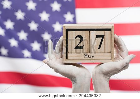 Cropped View Of Female Hands Painted In White Holding Cubes With Date Near American Flag