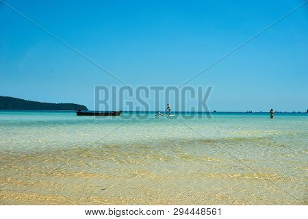 Stand Up Paddling At Beach At Nice Sunny Summer Day. Koh Rong Sanloem Island, Saracen Bay. Cambodia,