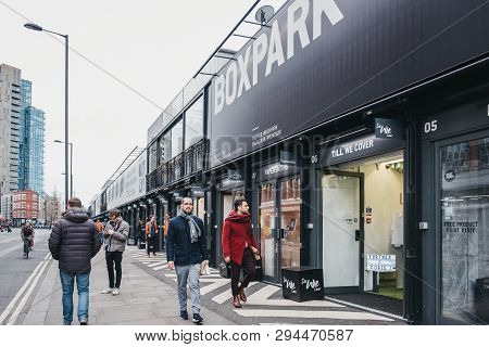 London, Uk - April 6, 2019: People Walking Past The Shops At Boxpark Shoreditch, London, Shipping Co