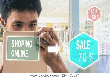 Man Holding Tablet For Blurred Bokeh Background E-shopping Marketing Digital, Consumer Purchase Shop