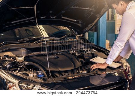 This Career Man Saleman Business Inspection Writing Note On Notepad Or Book, Paper With Car Blurry B
