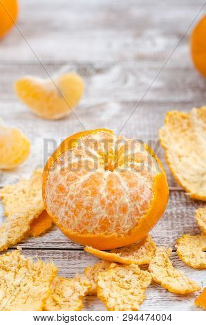 Peele Dripe Tangerines On Wooden Light Background