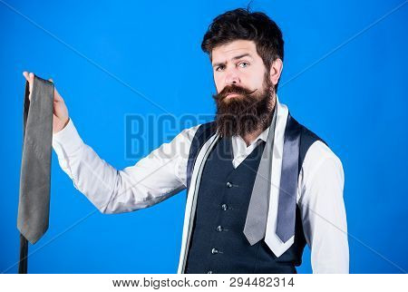It Looks Superbly Stylish. Bearded Man Holding Stylish Necktie. Brutal Guy In Stylish Clothes Choosi