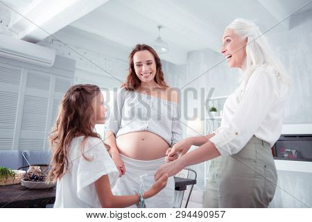 Cheerful Cute Girl Feeling Happy Seeing Her Lovely Grandmother