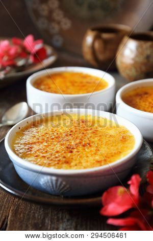 Creme Brulee, French Traditional Dessert, Three Portions. Rustic Style