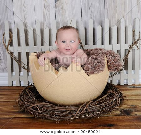 Happy Baby Sitting In Giant Egg Prop