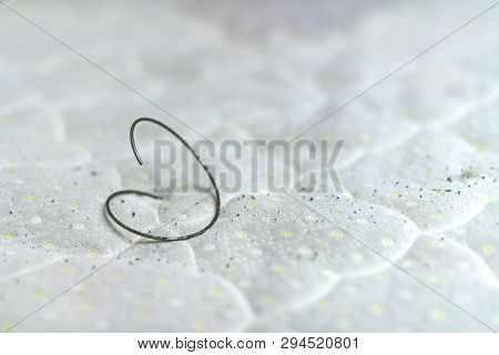 Spring In Old Bed Mattress With Pills. Hole In Old Dirty Leaky Couch, Need Of Repair Or Replacement.