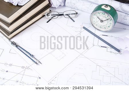 Several Drawings And Tools For Drawing On The Table In The Engineer