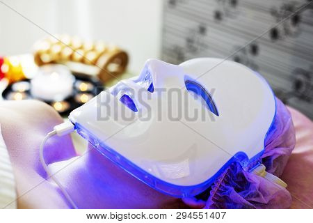 Photodynamic Therapy Facial Mask On Woman Face