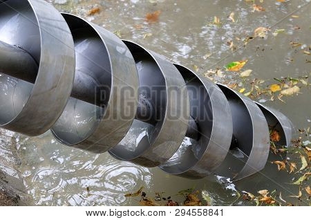 Screw Pump At Playground For Water Transportation, Outdoor Play Tool