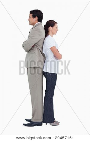 Sales team standing back to back against a white background