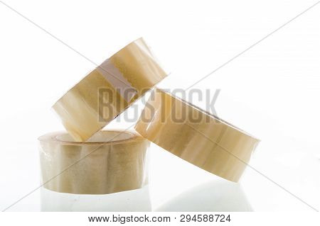 Several Rolls Of Adhesive Tape. Three Rolls Of Packaging Material. A Pyramid Of Circles.